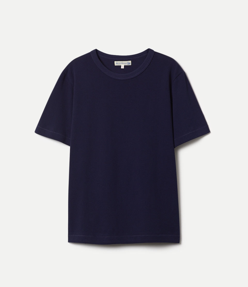 Navy blue loopwheeled pikée t-shirt on a light gray background