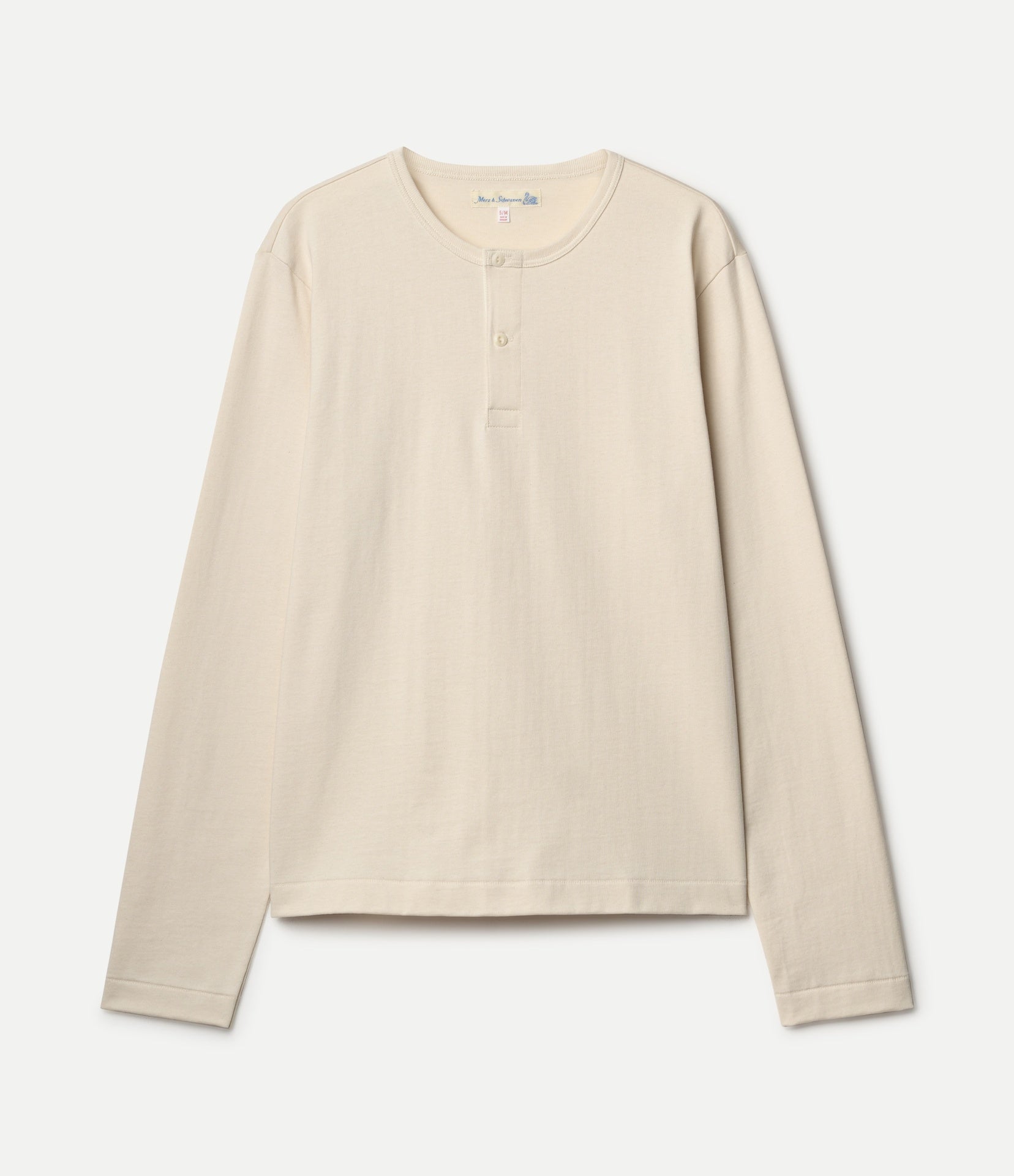A light beige cropped long-sleeve henley shirt with a three-button placket, displayed flat against a light gray background.