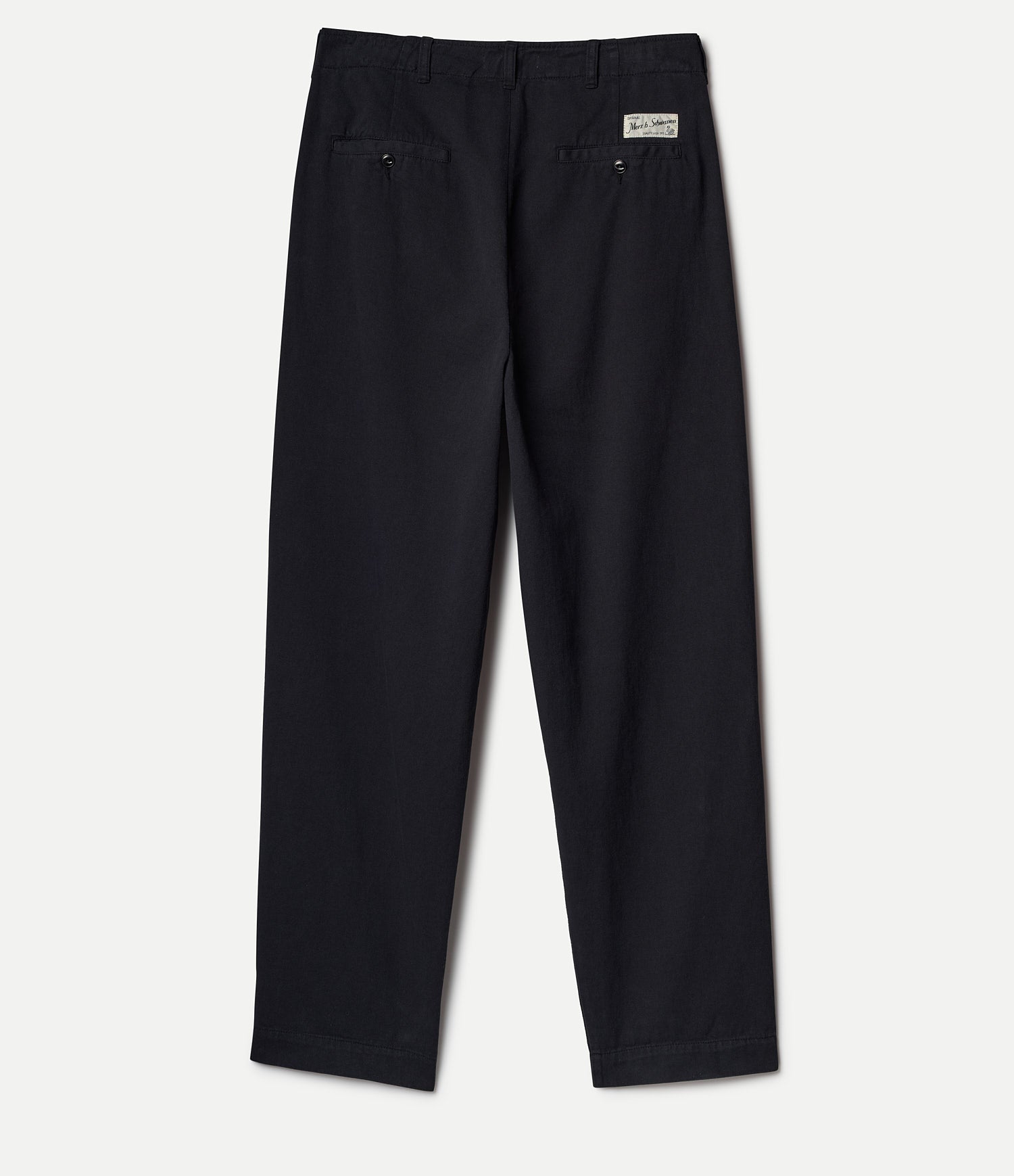 Black pants with a Merz b. Schwanen brand logo on a white background