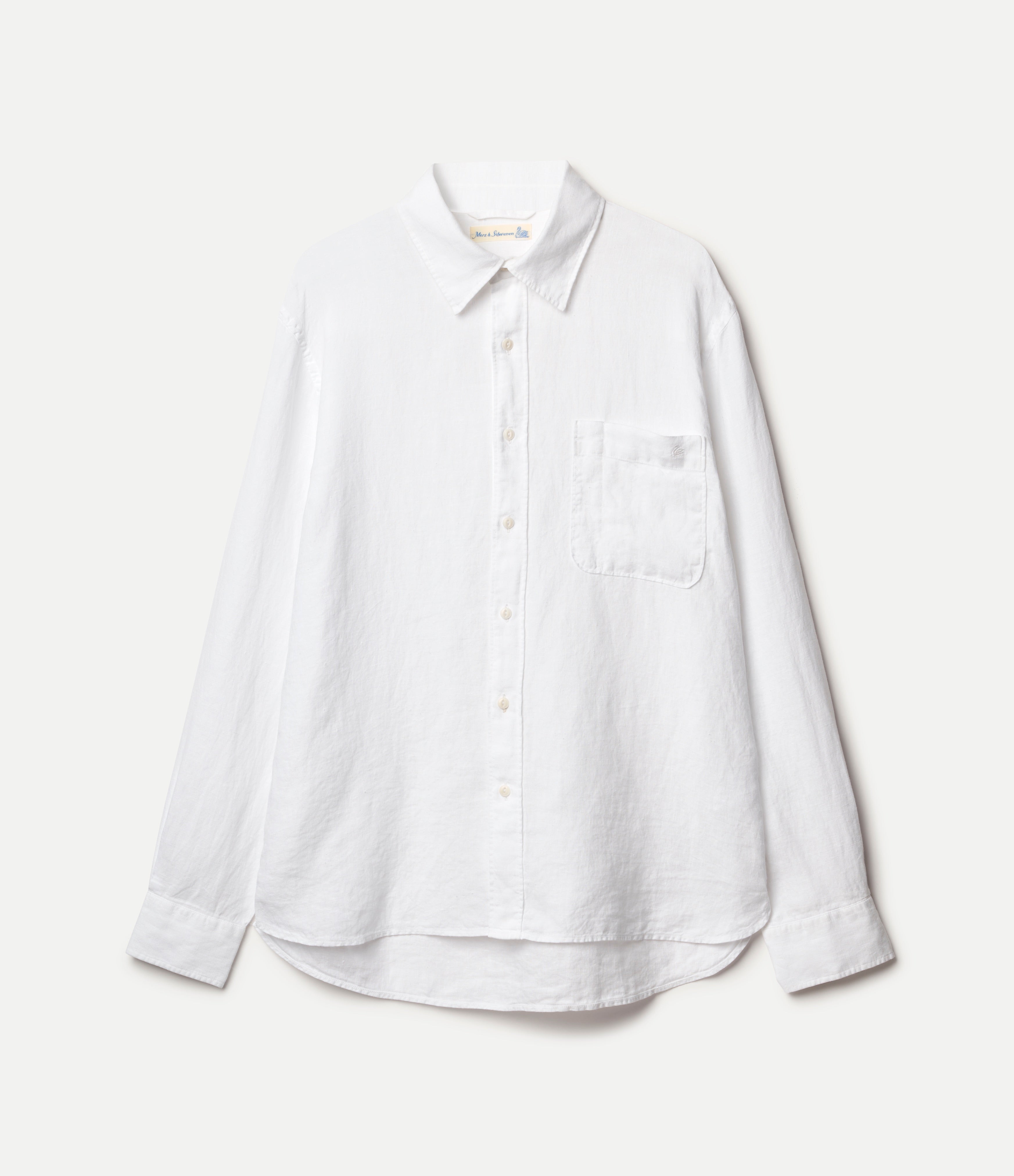 White button-up linen shirt on a light gray background