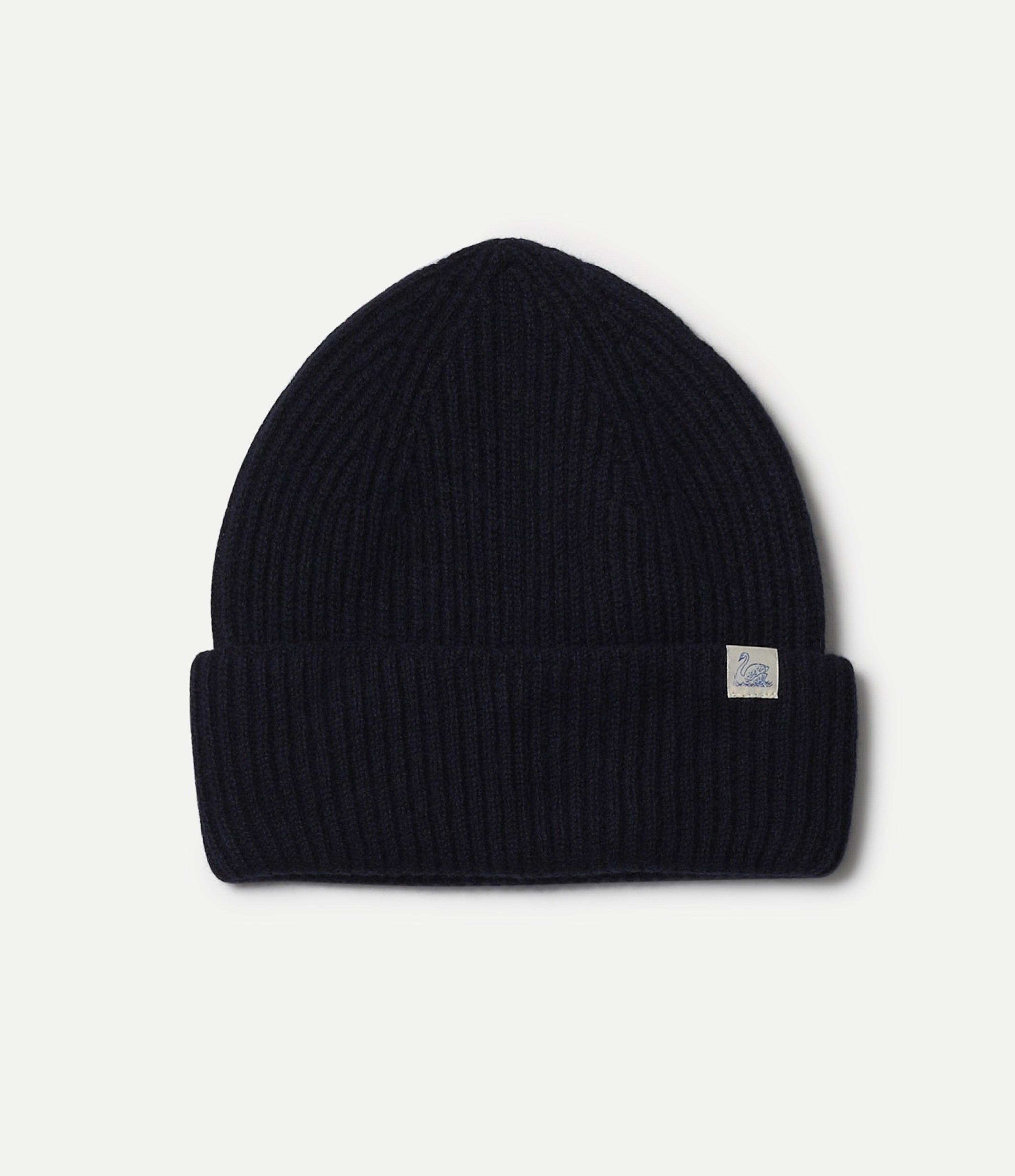 Dark navy beanie with a small logo tag on a light gray background