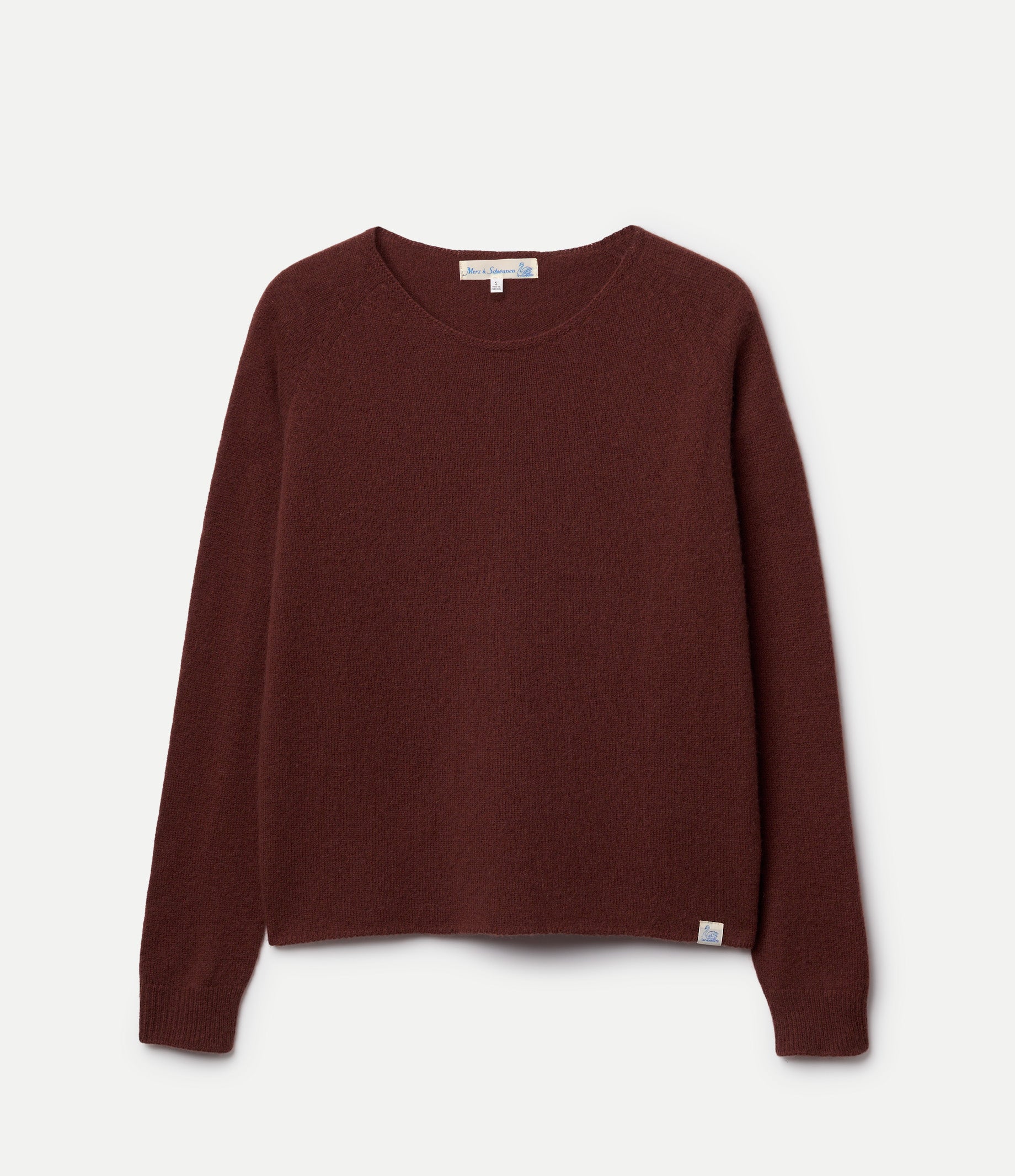 Brown sweater made of merino wool, silk and cashmere against neutral background