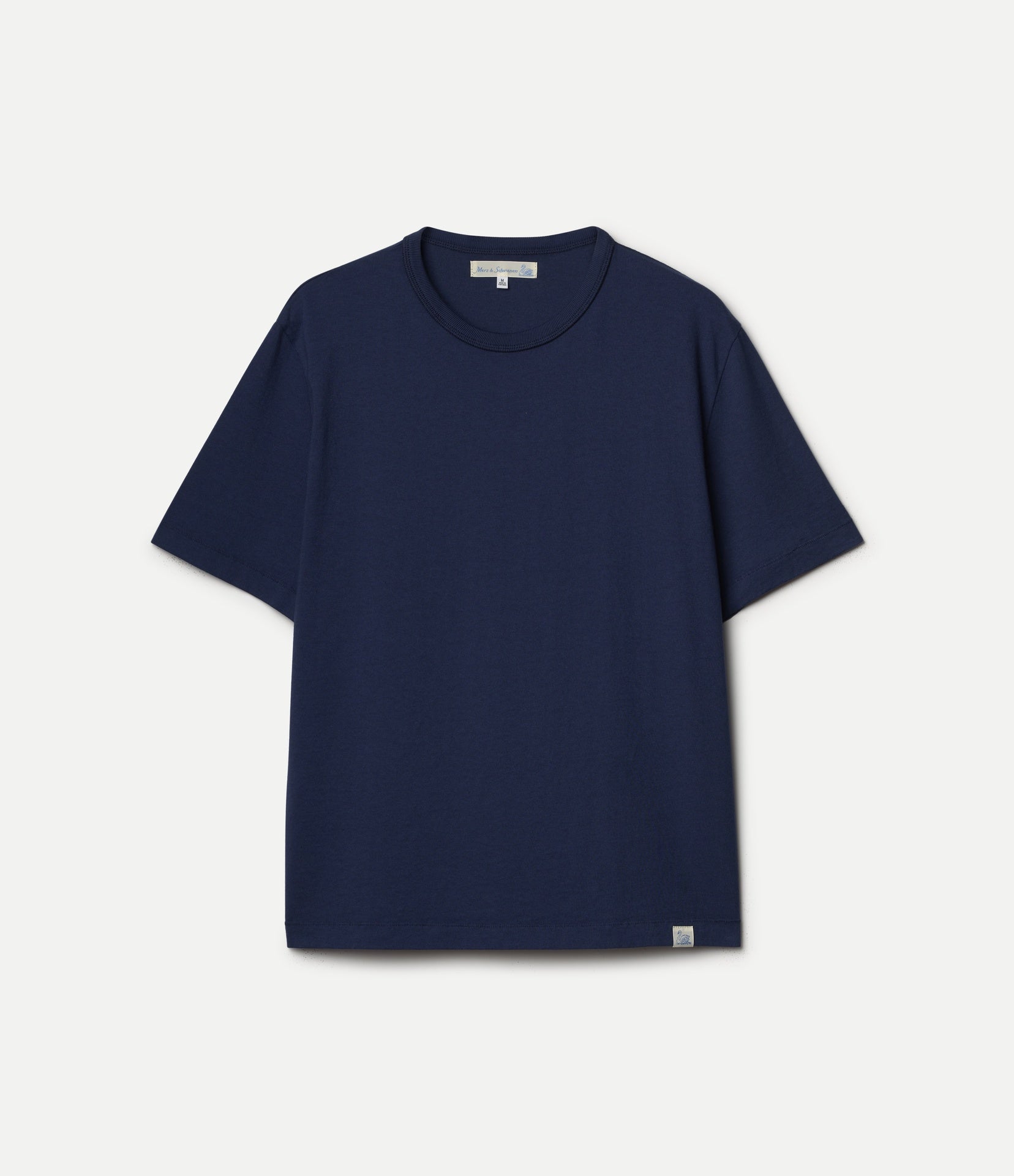 Navy blue crew-neck shirt on a gray background